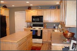 Kitchen Island and White Cupboards in Kitchen Remodeling